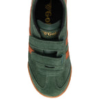 Green children's Gola trainer with orange velcro straps on a white background
