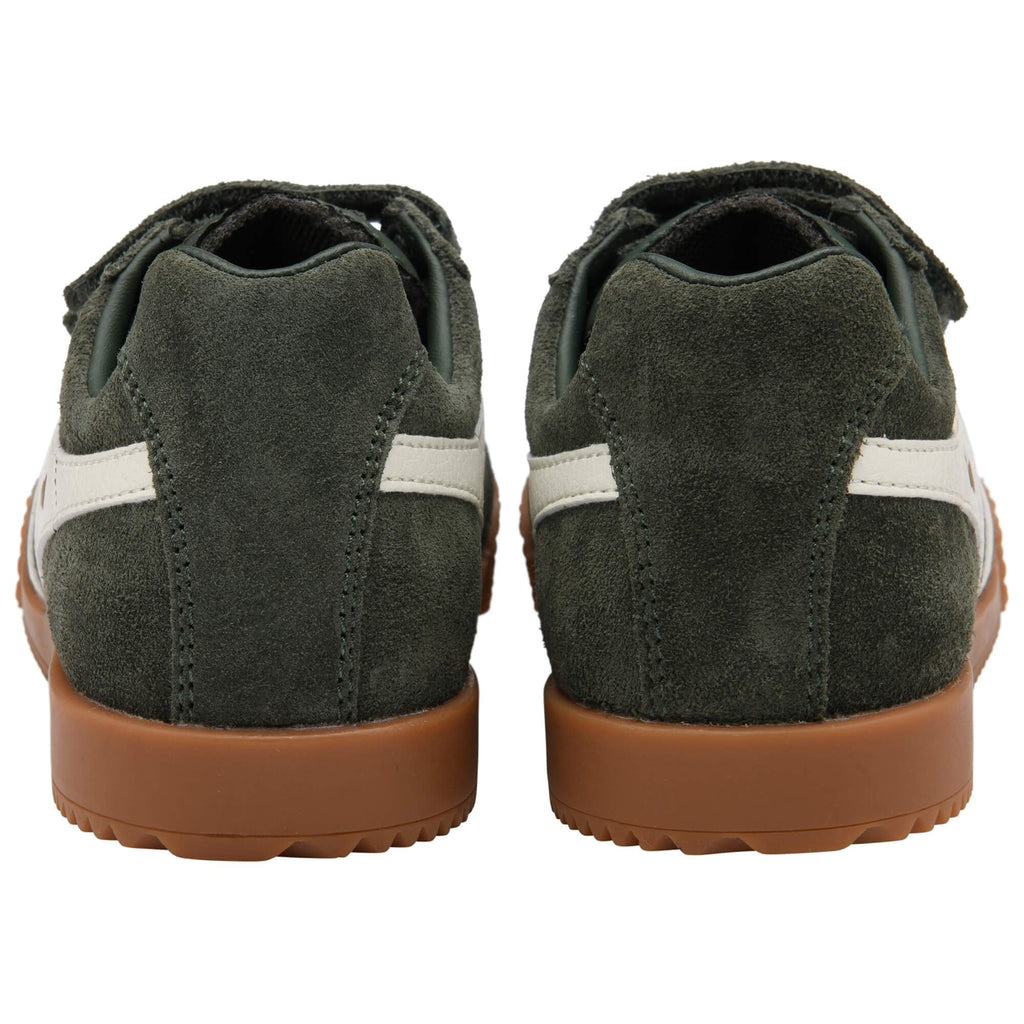 Pair of green suede Gola trainers with brown soles on a white background