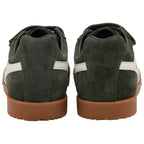 Pair of green suede Gola trainers with brown soles on a white background