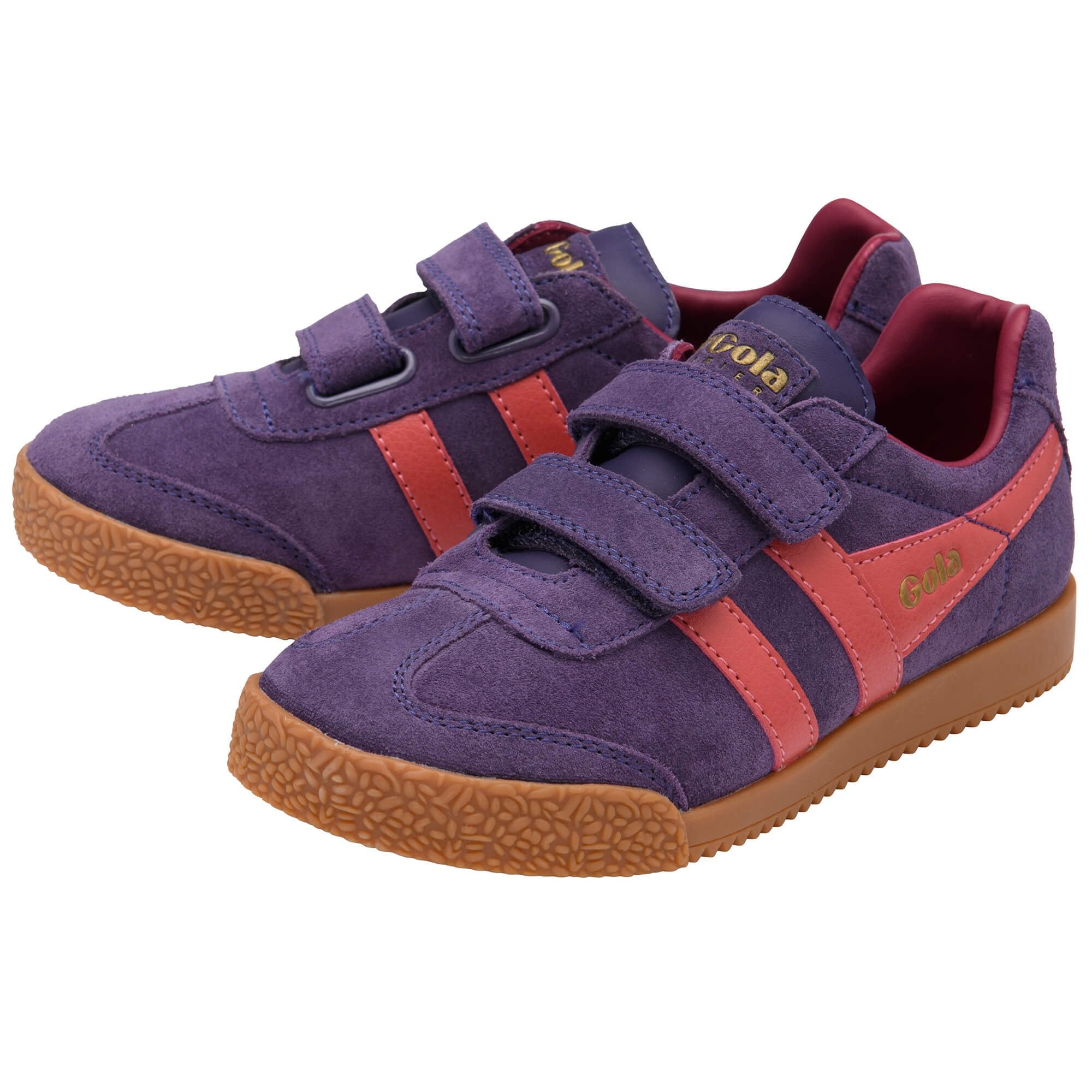Pair of purple suede Gola trainers with two coral stripes and two velcro straps on a white background