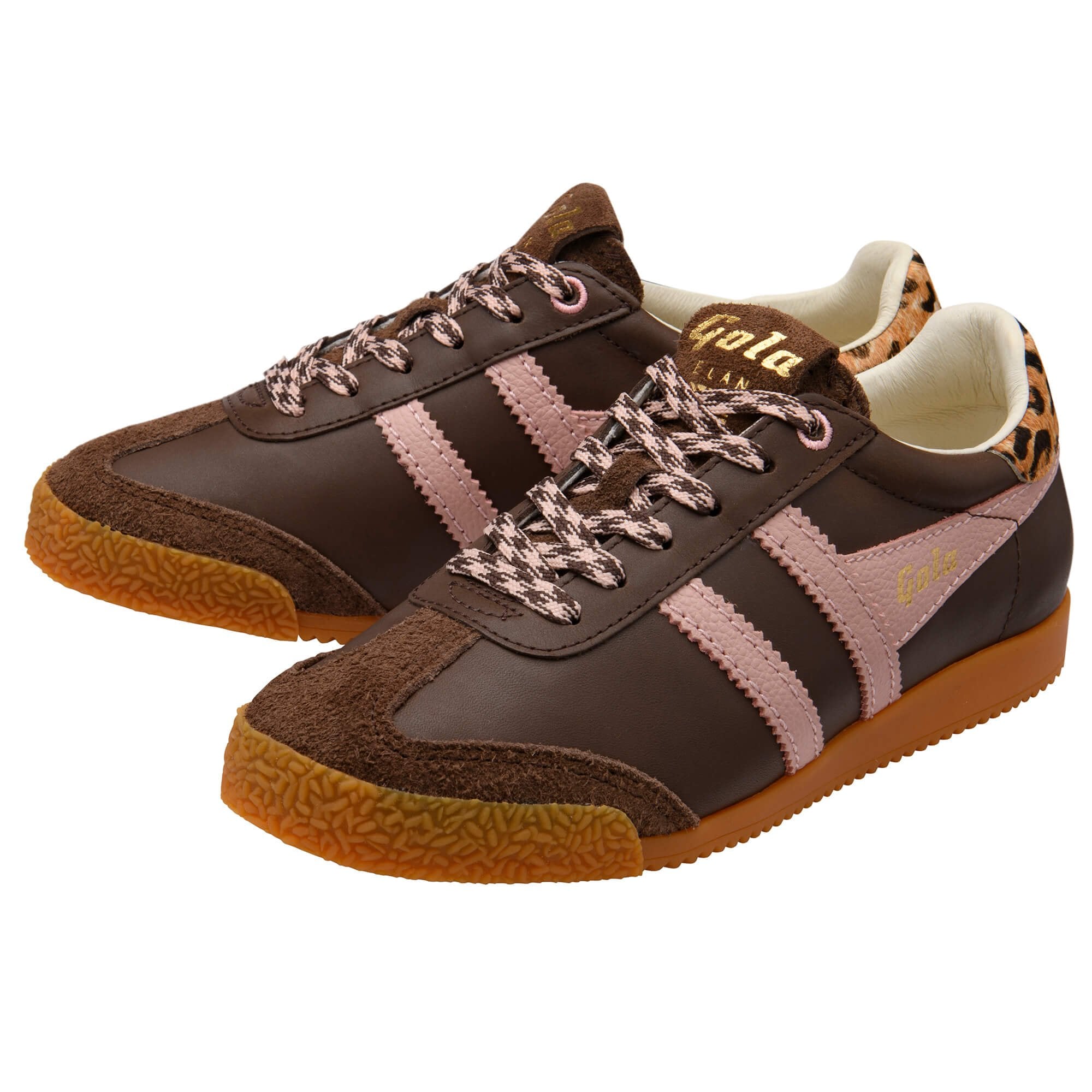 Brown and pink trainers with animal print accents on a white background