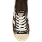 Leopard print trainer with white laces on a white background