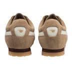 Pair of beige suede trainers with white stripes and a gold logo on the heel
