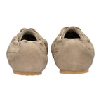 Rear view of a pair of beige suede ballet flats with elasticated tops and light brown soles
