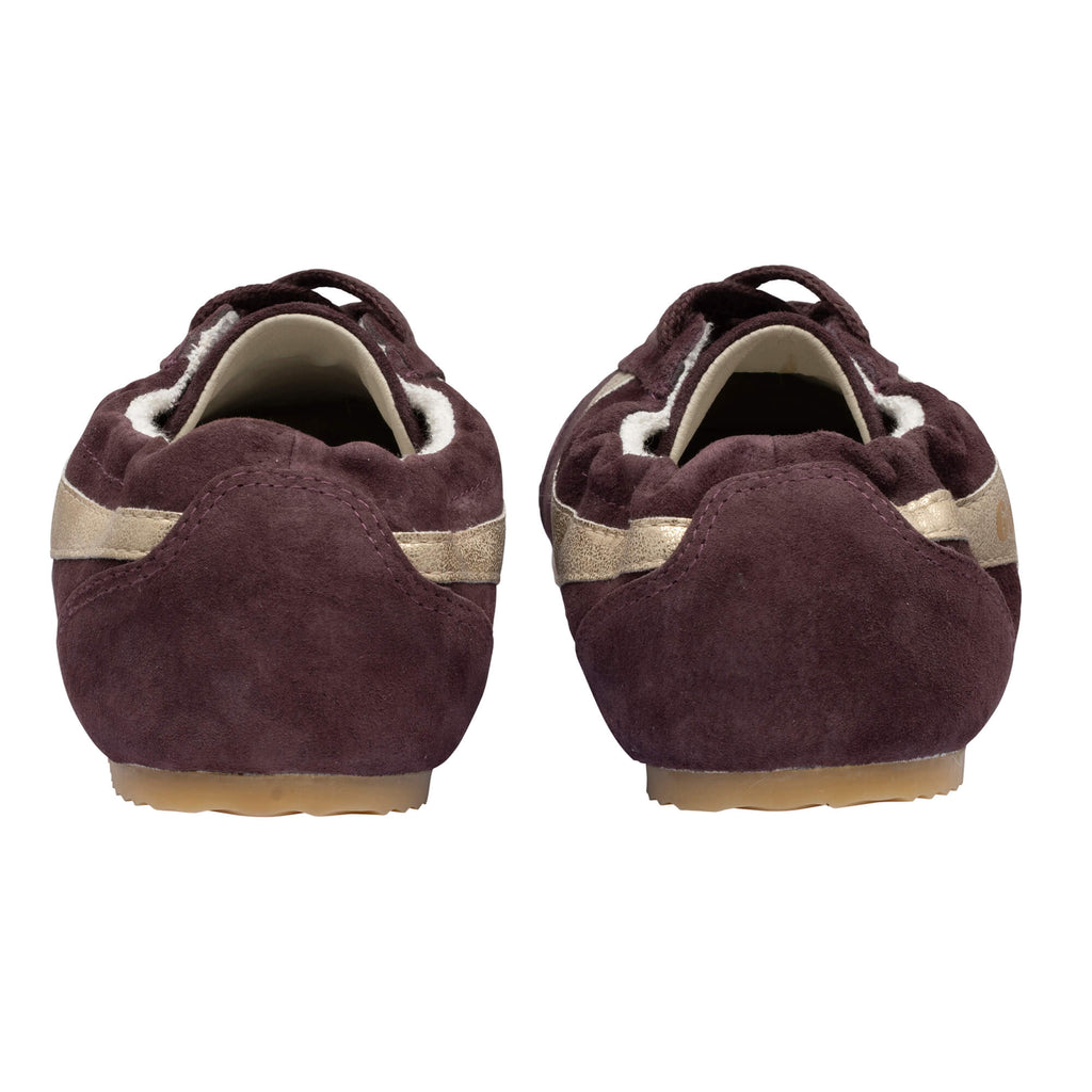 Pair of plum suede ballet flats with gold stripe detail, rear view