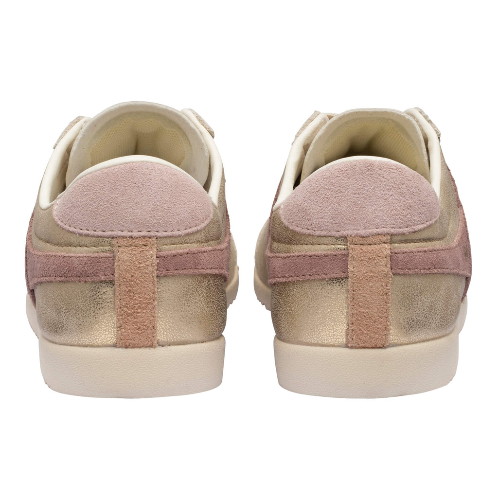 Rear view of two gold and pink trainers