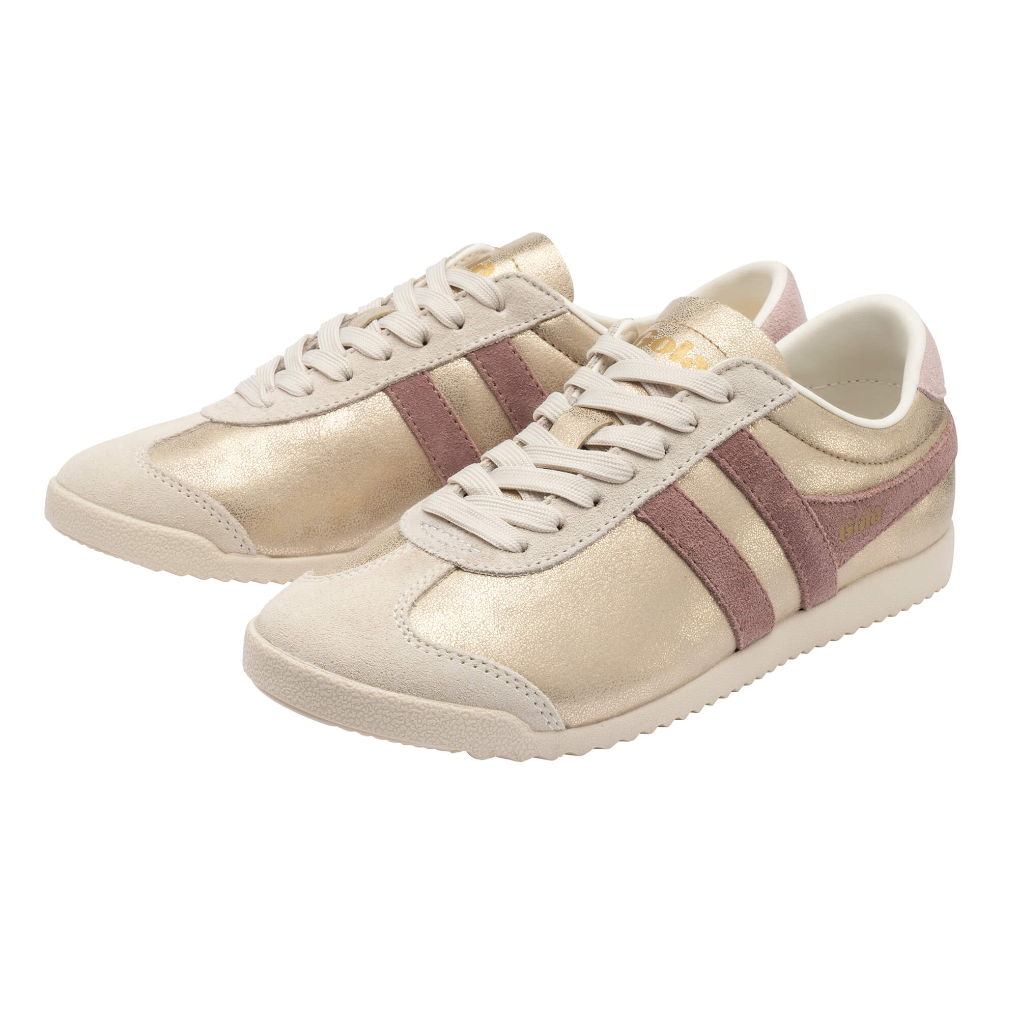 Pair of gold and pink trainers with white laces and soles
