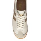Top-down view of a Gola trainer in off-white with brown stripes and laces