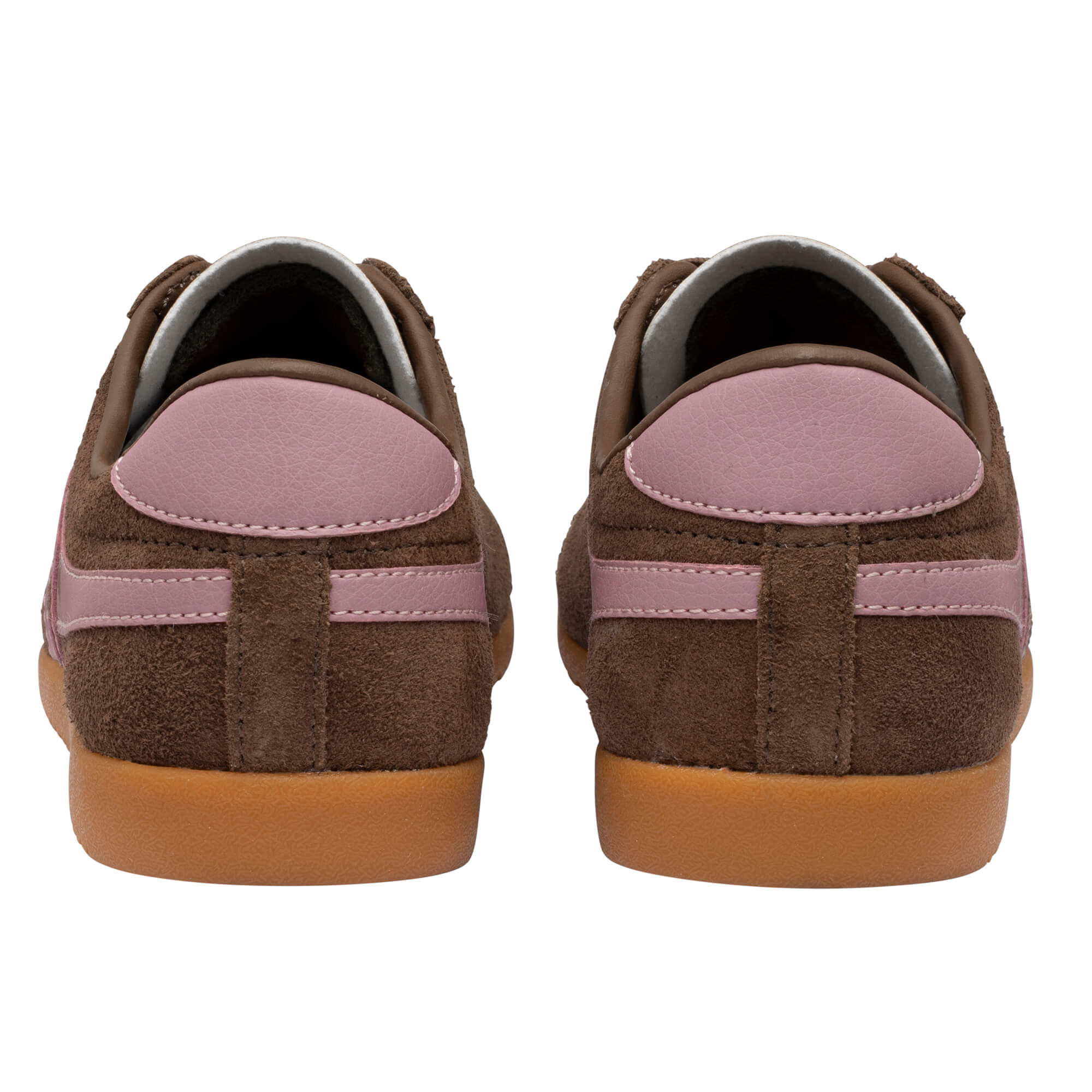 Pair of brown suede trainers with pink accents and gum soles, rear view