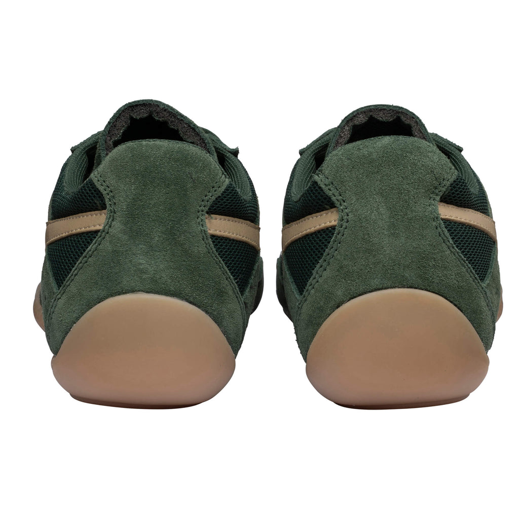 Pair of dark green suede and mesh trainers with tan soles and side stripes, rear view