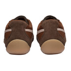 Pair of brown suede and mesh trainers with light brown soles, rear view