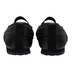 Pair of black trainers, rear view