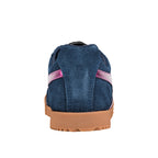 Rear view of a navy blue suede trainer with a gum rubber sole and pink side stripe