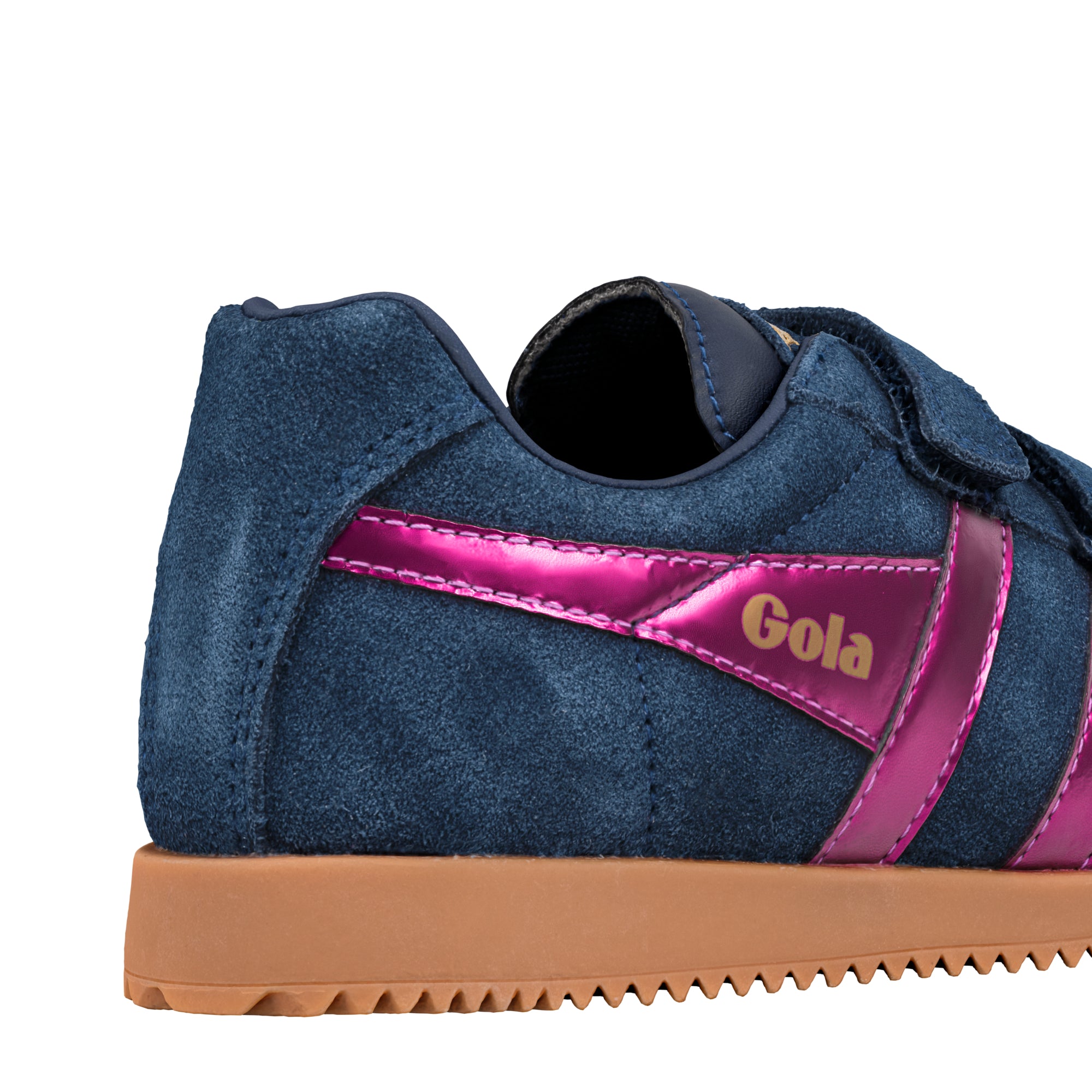 Close up of navy blue suede trainer with metallic pink side stripes and gum sole