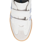 White Gola trainer with two hook and loop straps and a gum sole