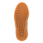 Gum rubber trainer sole with chevron tread pattern and Gola branding