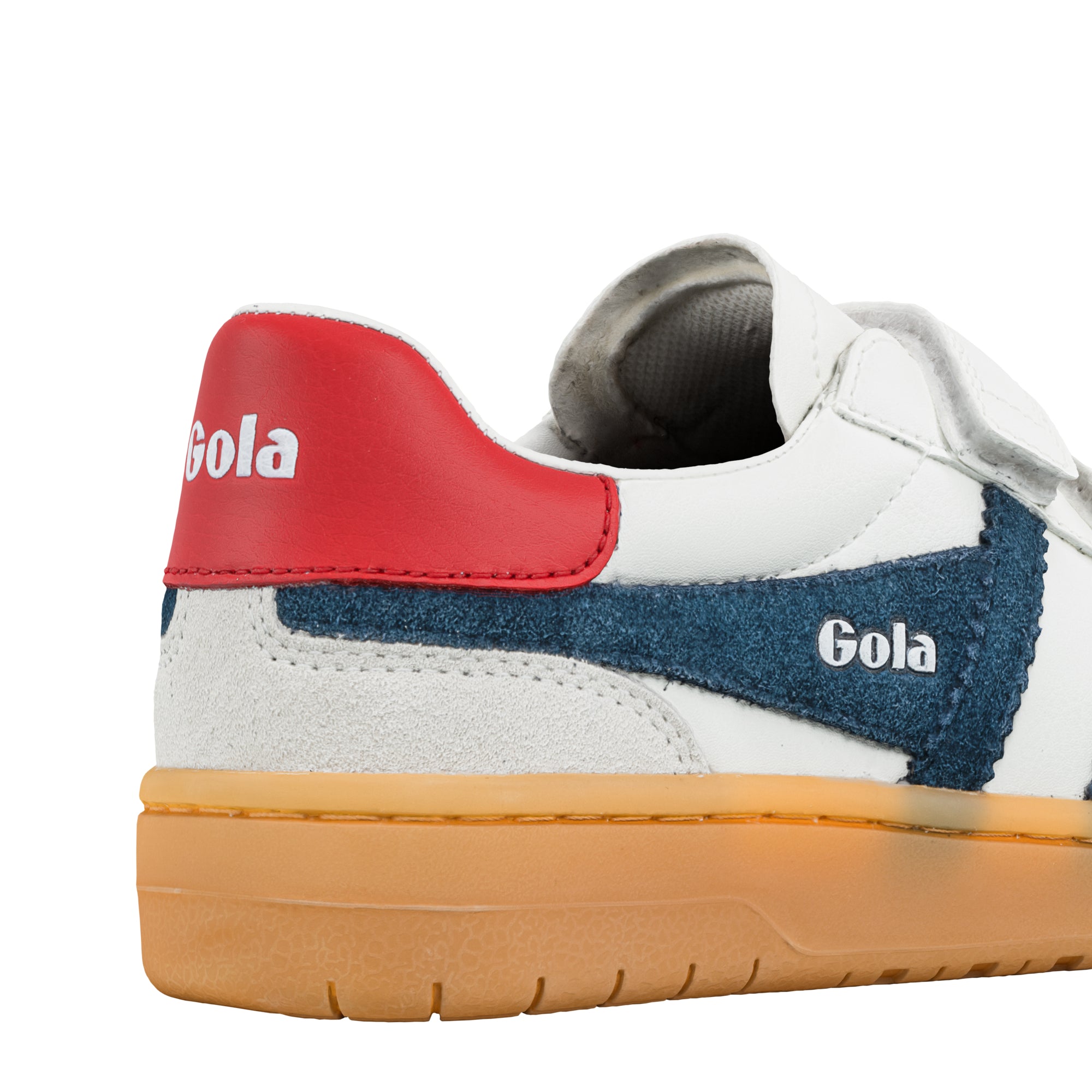 Close up of white Gola trainer with red heel tab and blue suede side panel on a gum sole