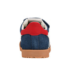 Rear view of a navy blue suede trainer with a red heel tab and gum rubber sole