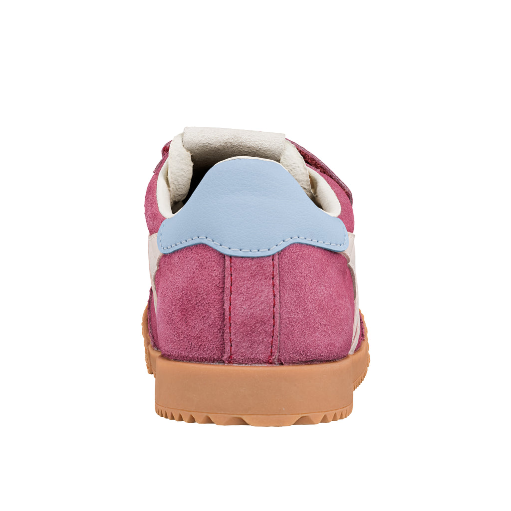 Rear view of a pink suede trainer with a light blue heel tab and a gum rubber sole