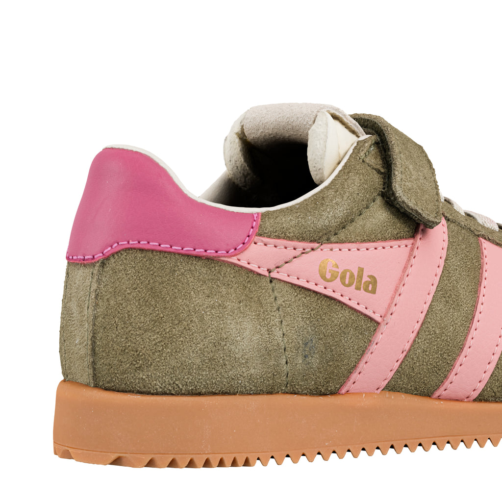 Close up of olive green suede trainer with pink leather trim and gum sole