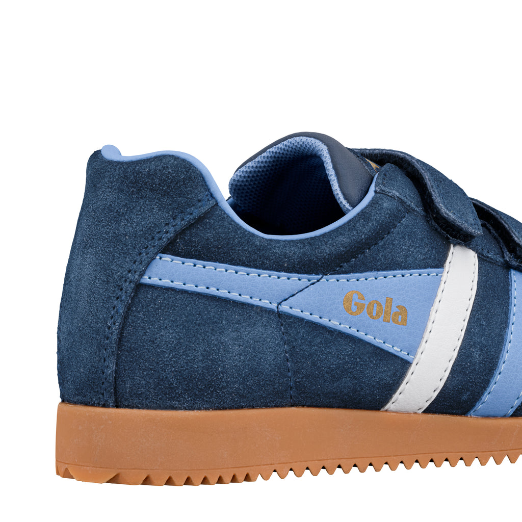 Close up of the heel and side of a navy blue suede Gola trainer with a gum sole