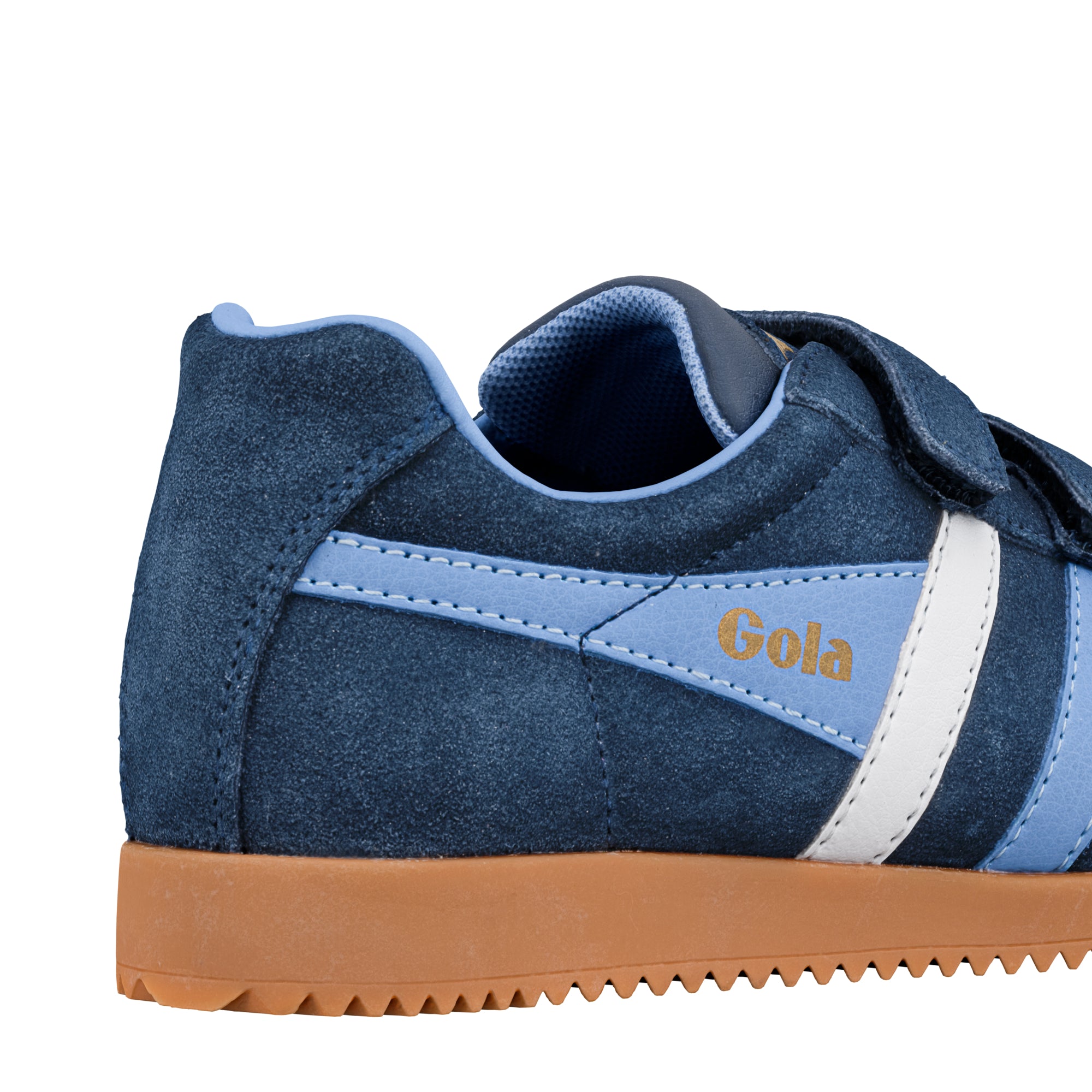 Close up of the heel and side of a navy blue suede Gola trainer with a gum sole