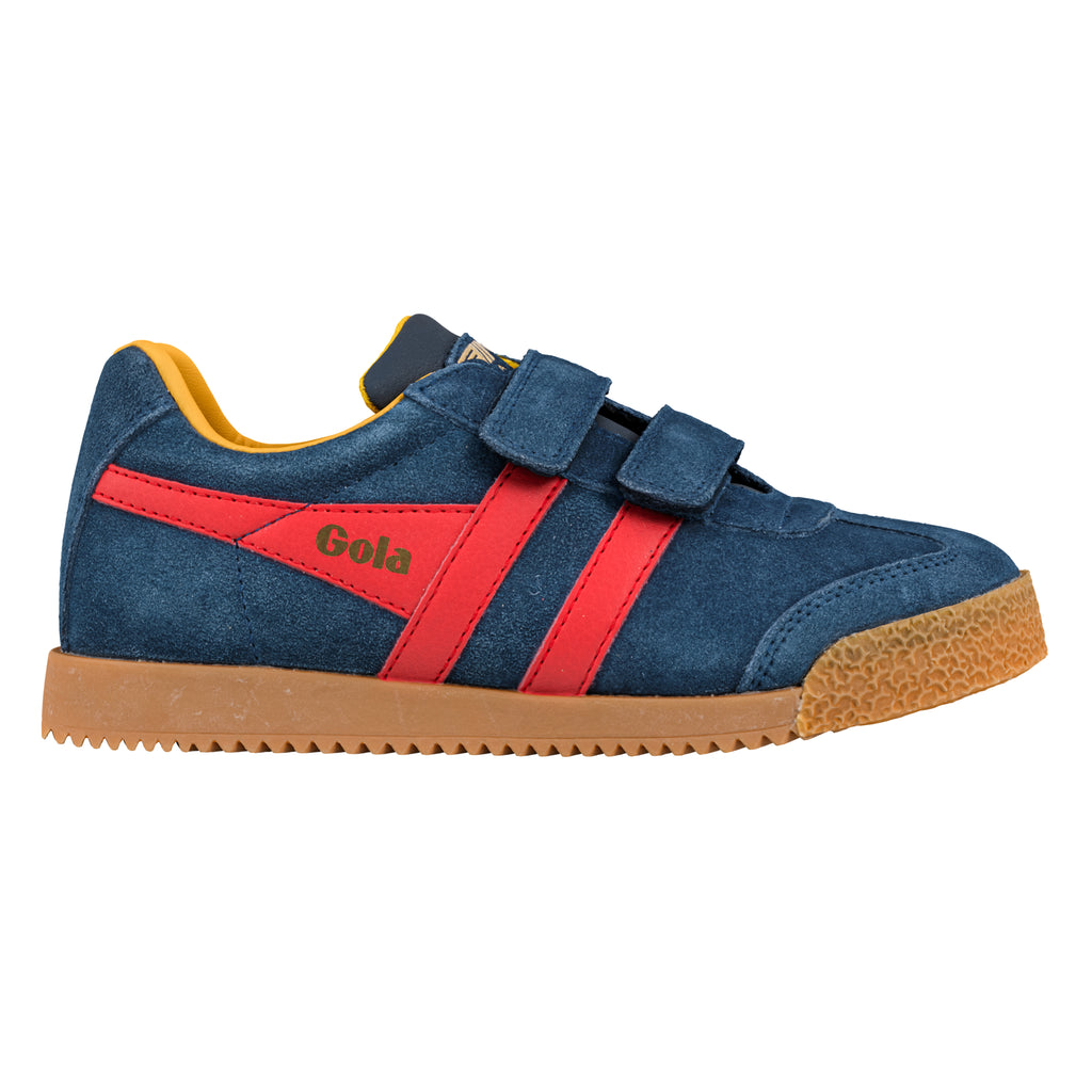 Navy blue suede trainer with red side stripes and gum sole featuring hook and loop fastening