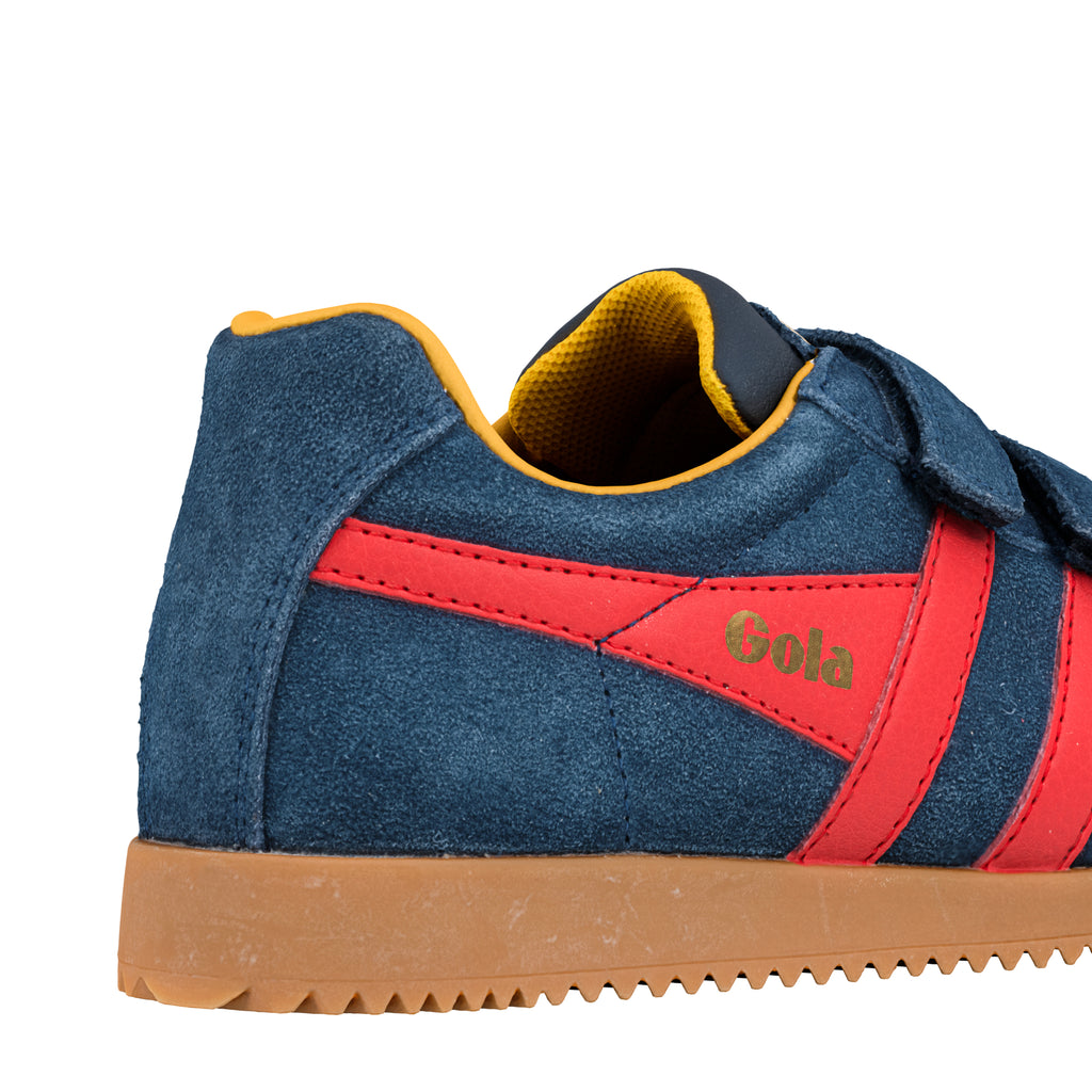 Rear view of a navy blue suede Gola trainer with red side stripes and a gum sole