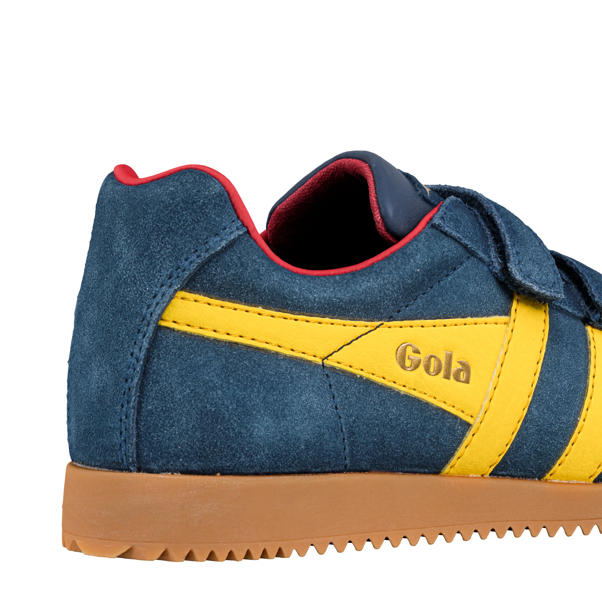 Close up of blue suede trainer with yellow side stripes and gum sole