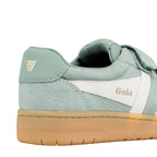Close up of sage green suede trainer heel with white side panel and gum rubber sole
