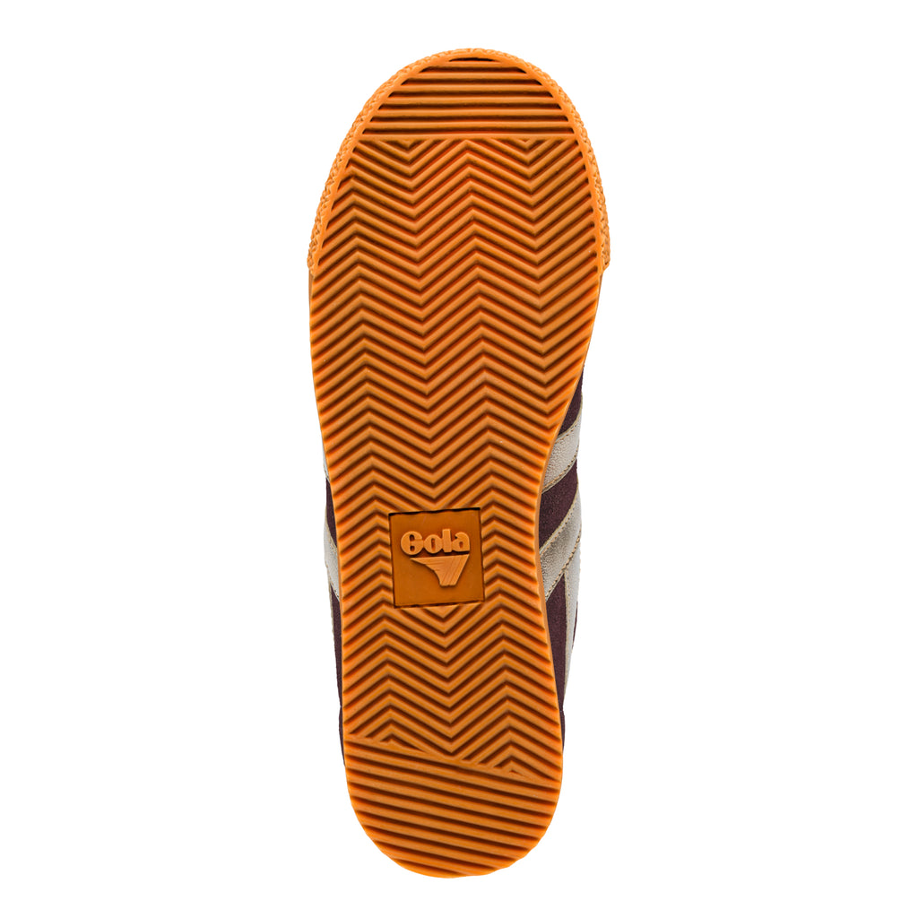 Orange rubber trainer sole with herringbone tread pattern and Gola logo
