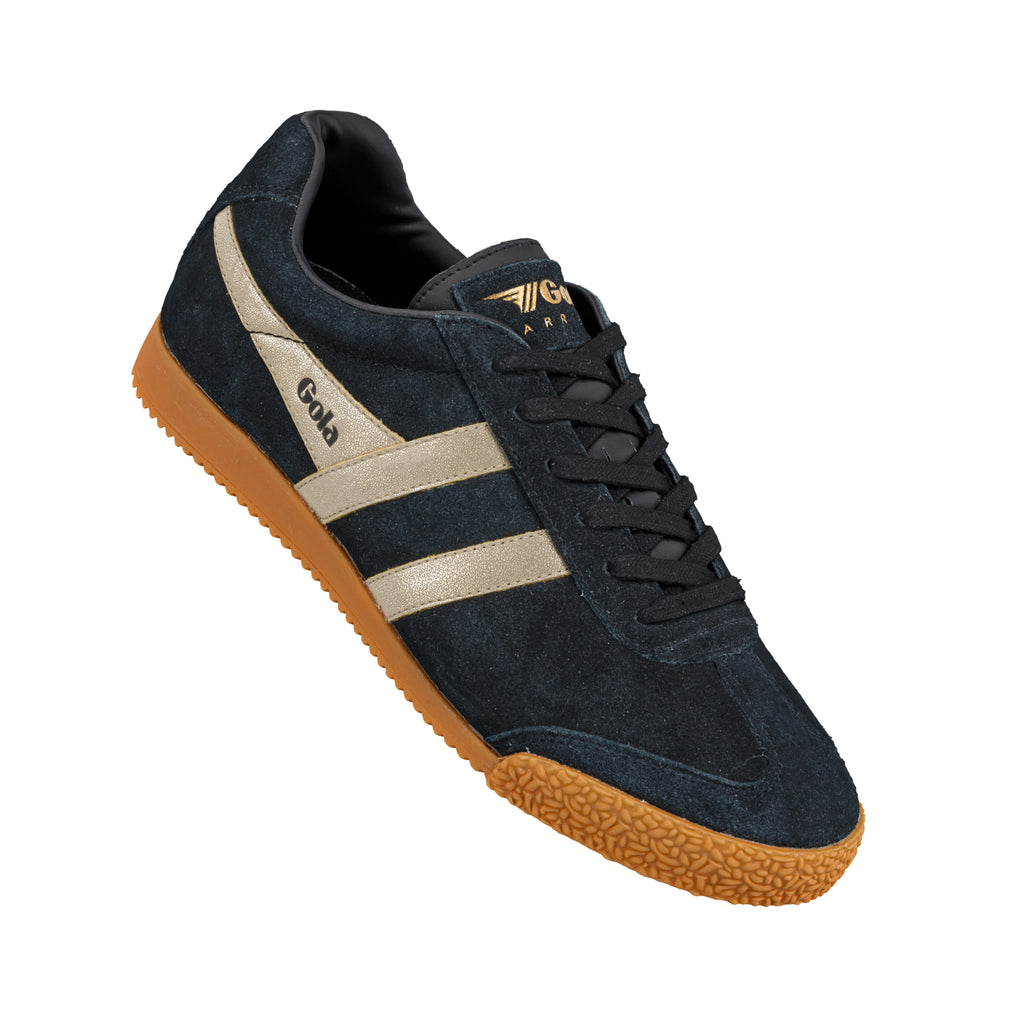 Navy suede Gola trainer with gold side stripes and a gum rubber sole