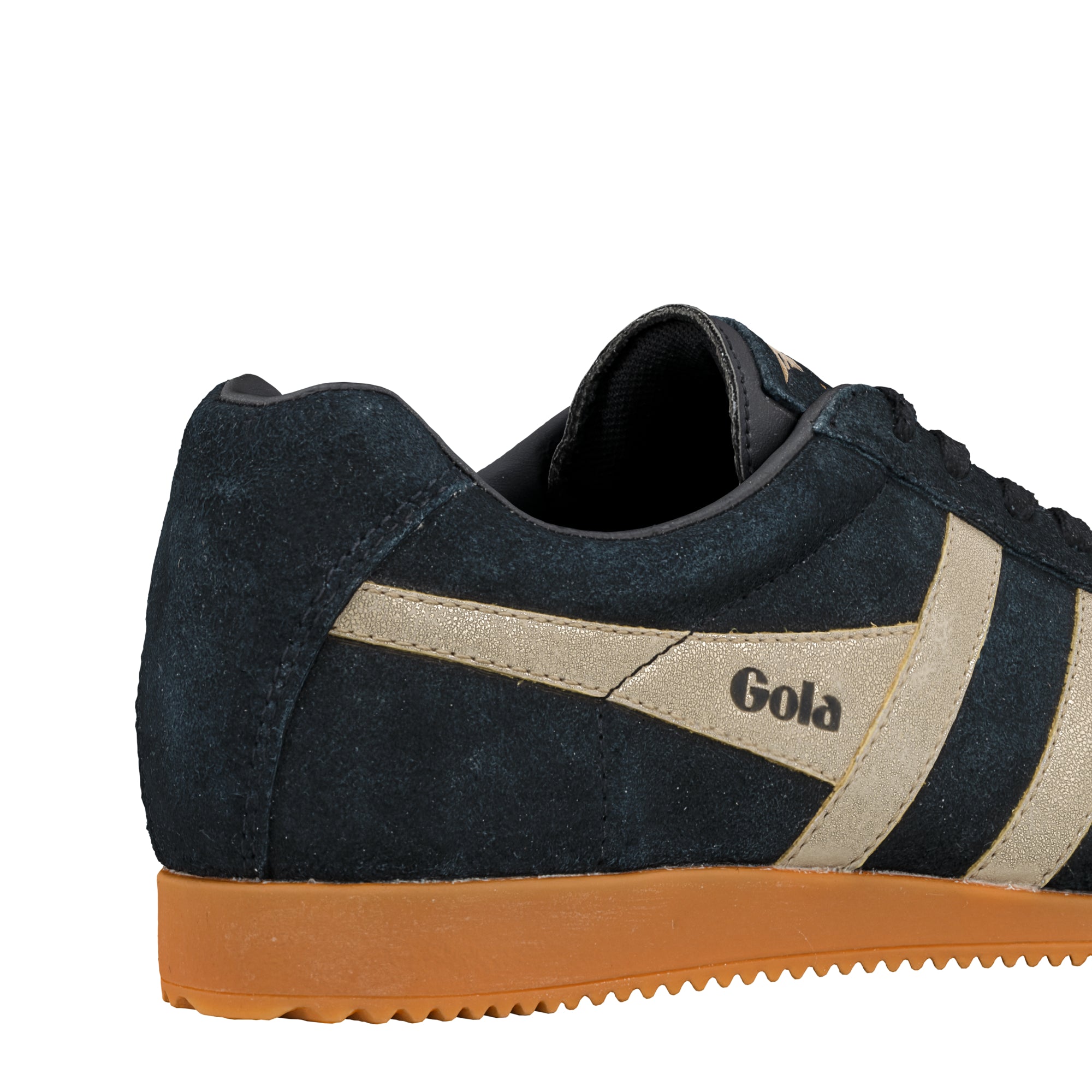 Rear side view of a navy suede Gola trainer with gold side stripes and a gum rubber sole