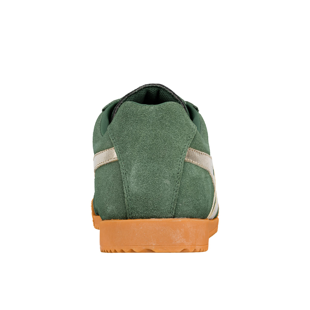 Rear view of a green suede trainer with a gum rubber sole