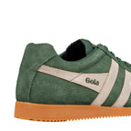 Close up of green suede Gola trainer with cream side stripes and gum sole
