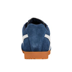 Rear view of a navy blue suede trainer with white stripes and a brown rubber sole