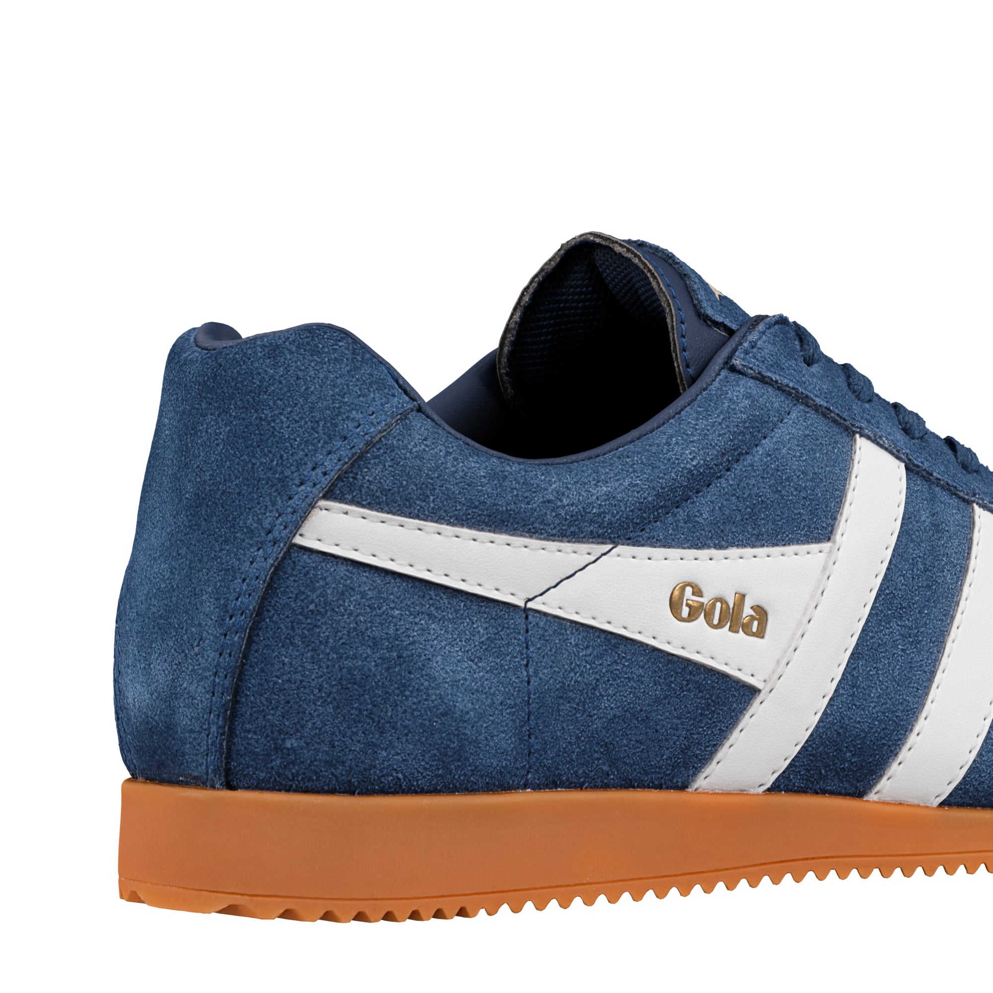 Close-up of a Gola trainer in blue suede with white stripes and a brown sole