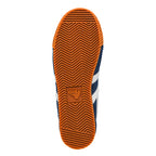Underside of a navy blue Gola trainer with white stripes and an orange sole
