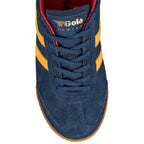 Top view of a navy blue suede Gola Harrier trainer with yellow stripes and a gum sole