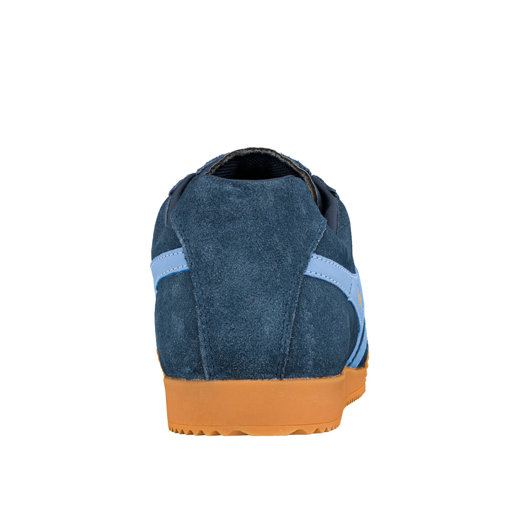 Rear view of a navy blue suede trainer with a light blue stripe and gum rubber sole