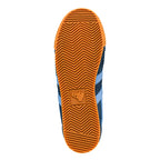 Gum rubber sole of a Gola trainer with a chevron tread pattern