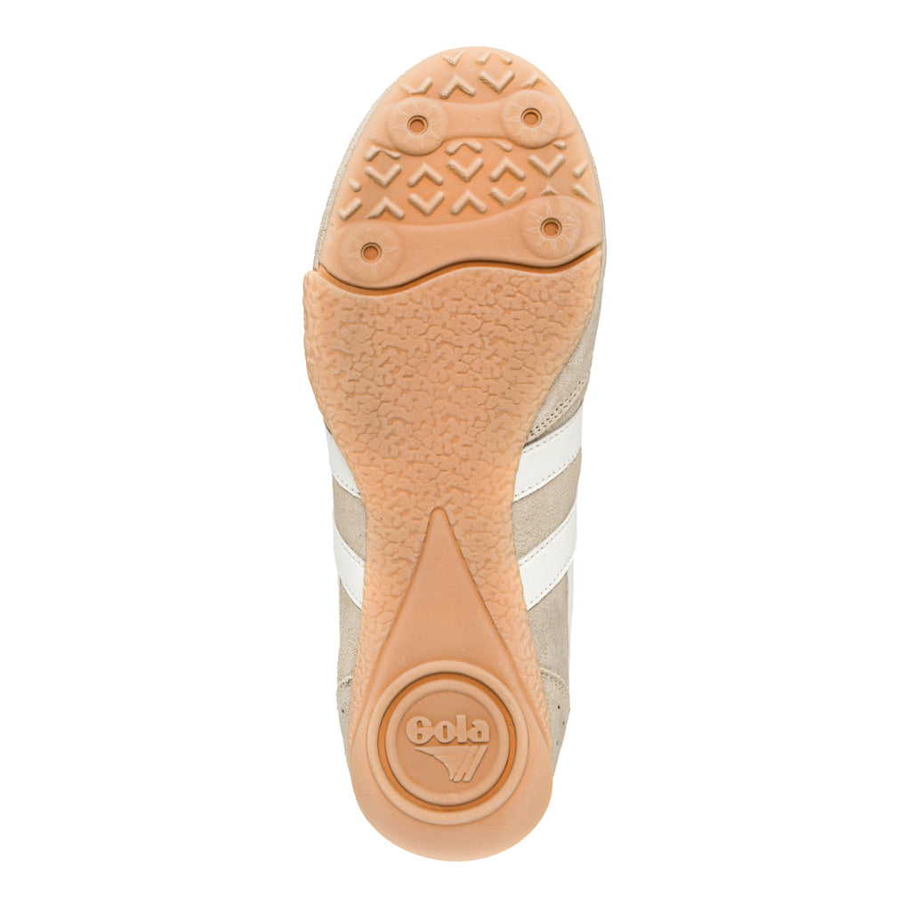 Underside of a Gola trainer showing the gum rubber sole pattern and branding