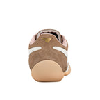 Rear view of a brown suede trainer with a beige rubber heel and gold logo