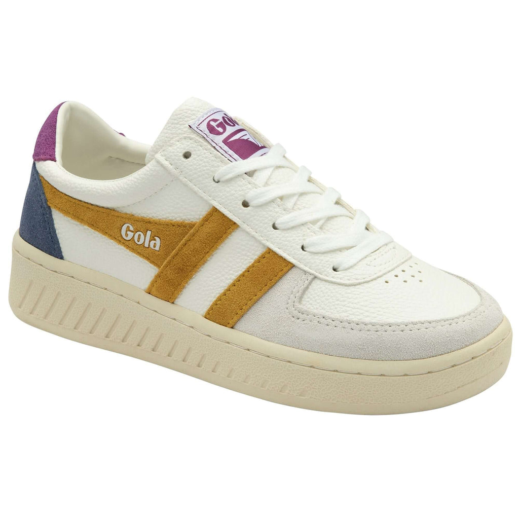 White Gola trainer with gold stripes, purple heel, and blue accent on a white background
