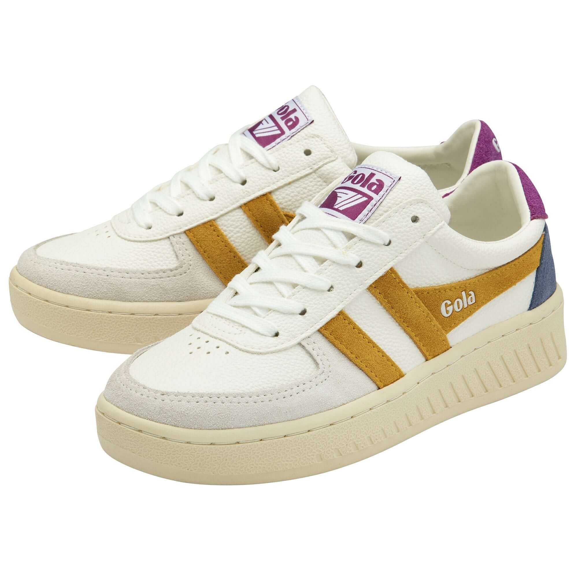 Pair of Gola trainers in white with yellow stripes and purple accents on a white background
