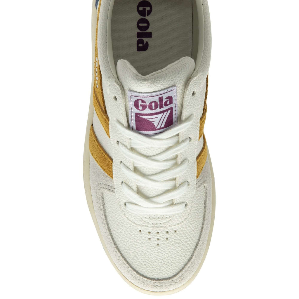 White Gola trainers with yellow side stripes on a white background