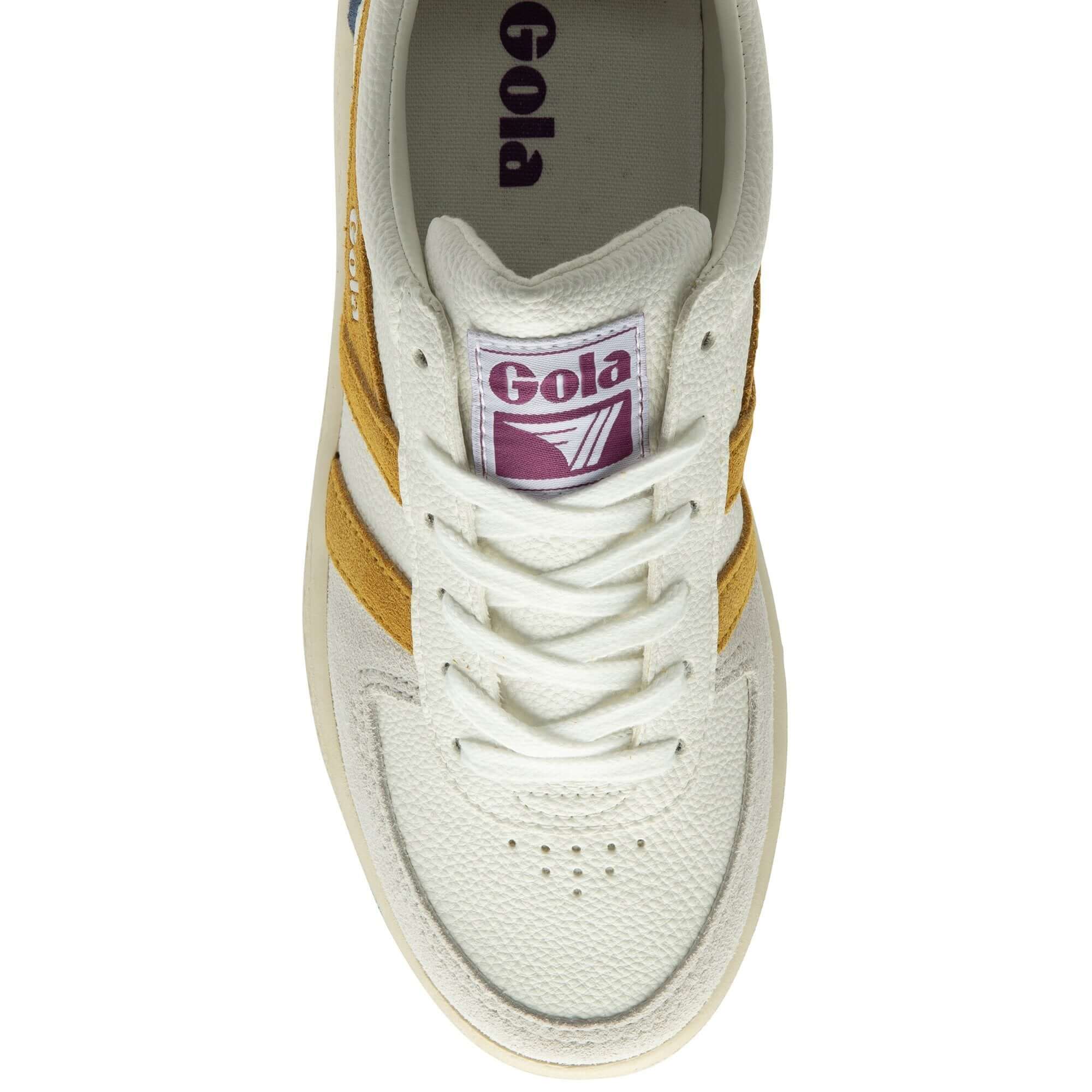White Gola trainers with yellow side stripes on a white background