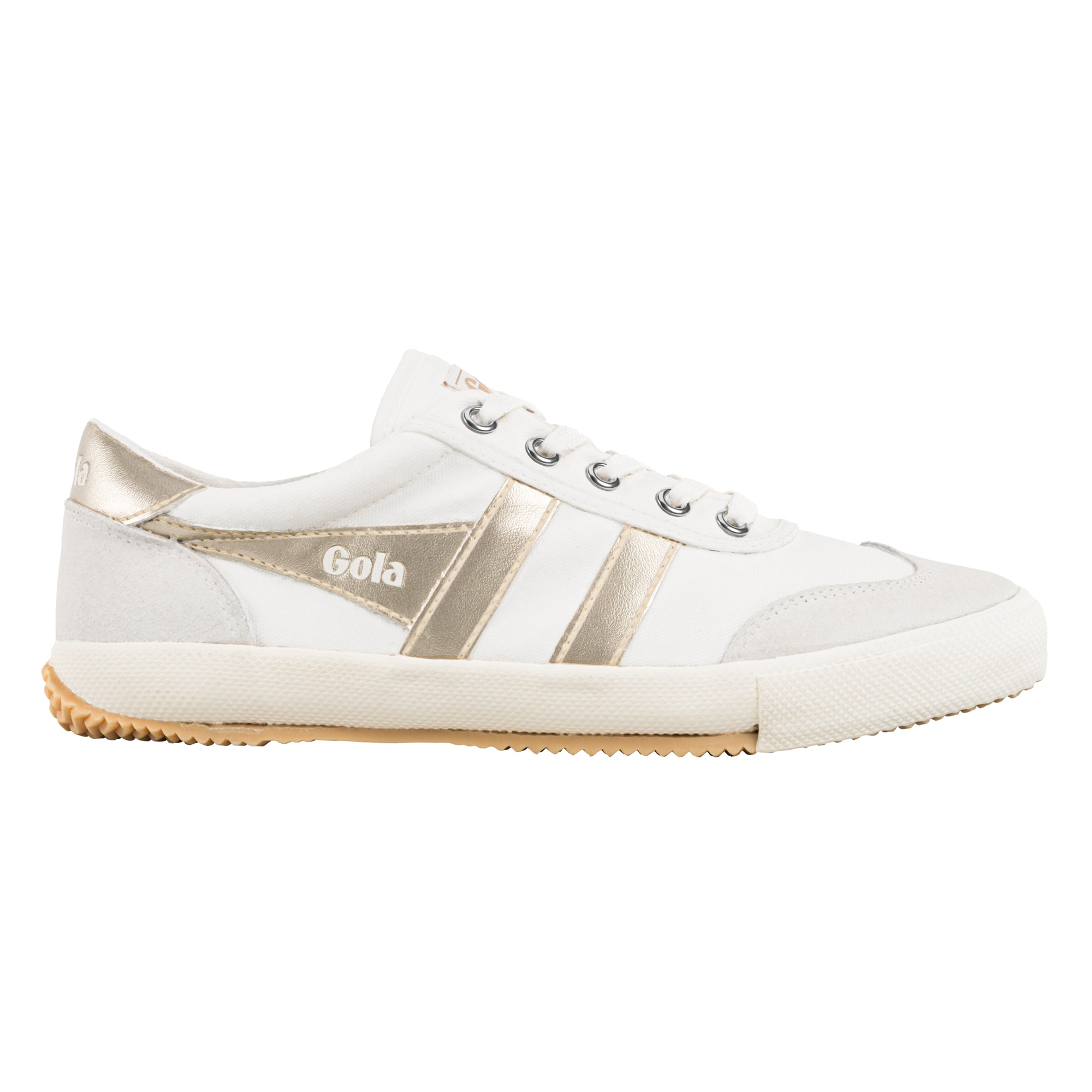 White canvas trainer with metallic gold side stripes and gum rubber sole