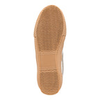 Tan rubber trainer sole with wavy tread pattern