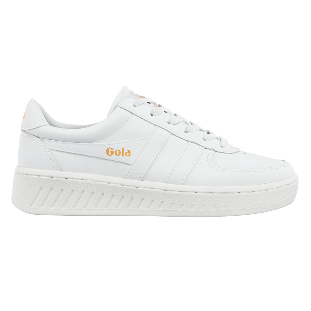 White Gola trainer with orange branding on the side and heel